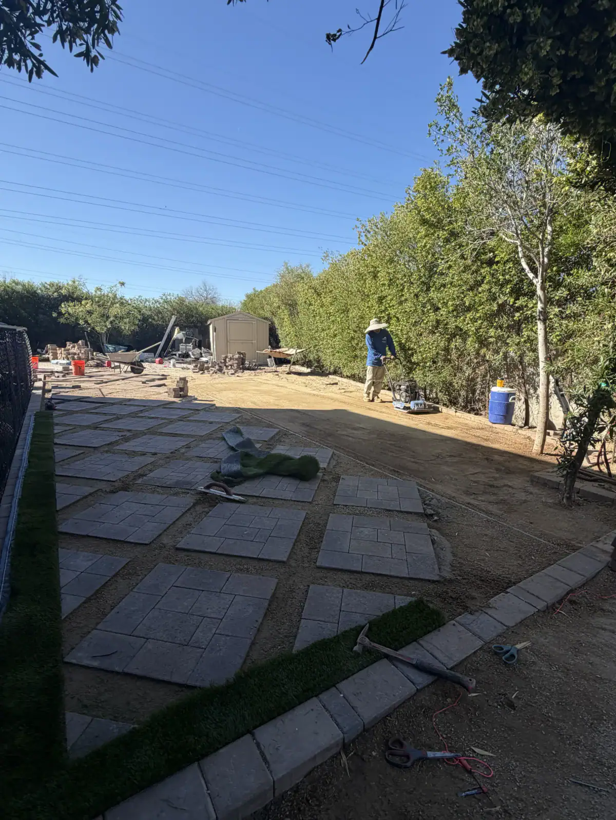 V Soto's crew installing the paver and turf layout