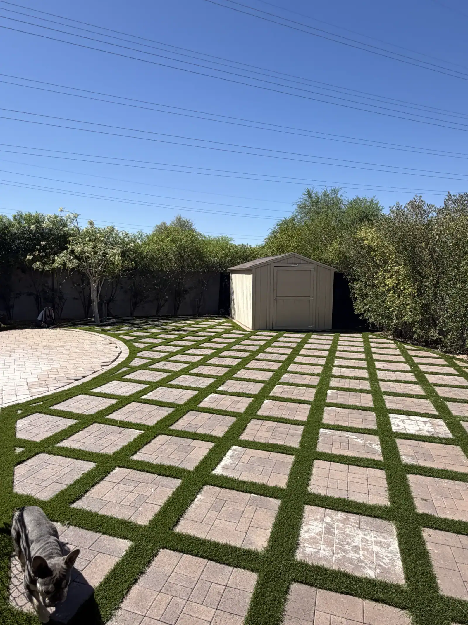 Finished paver and artificial turf yard installed by V Soto's Landscape
